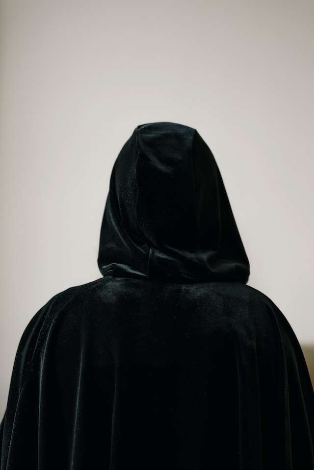 Cloaked figure