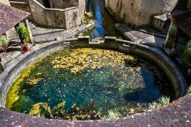 Visitors enjoy the Fosse Dionne Spring