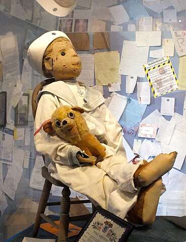 Robert the Doll sits in his chair at Fort East Martello Museum